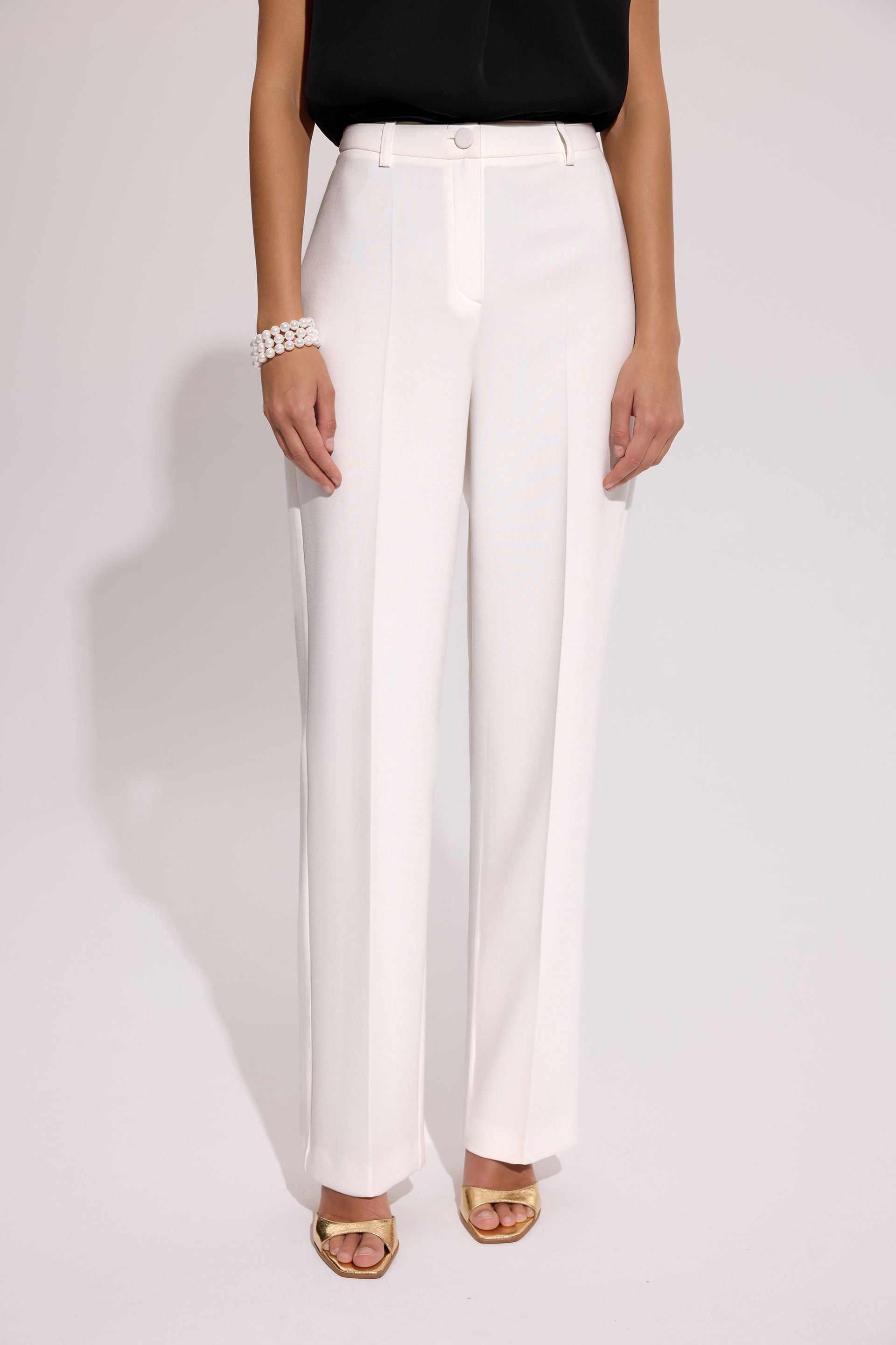 Eleganckie spodnie damskie ecru – kolekcja Exclusive